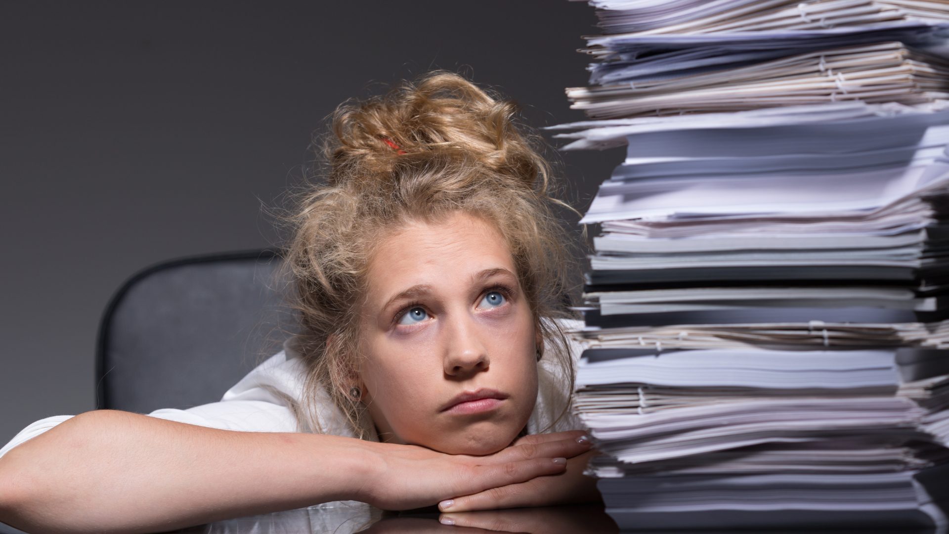 Buried under vehicle paperwork, reaching for the app